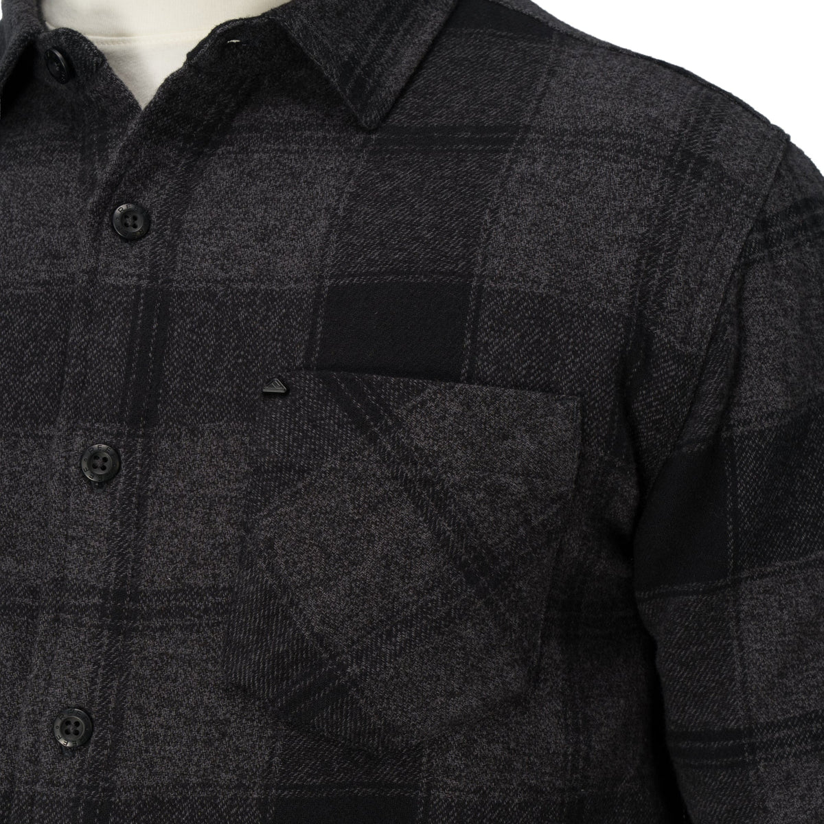 Close-up of the chest pocket and buttons on the Reggie Flannel Shirt in dark gray plaid from StoreRank.ai All Products.