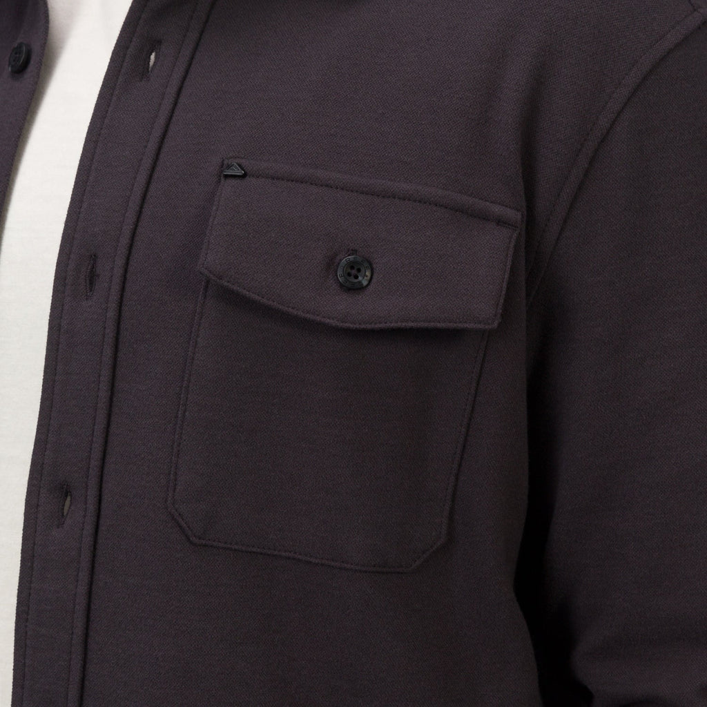 Close-up of the chest pocket and button flap on the Raymond Ls Shirt, showing soft, durable fabric and surf-inspired design.