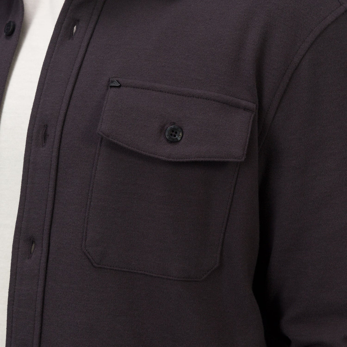 Close-up of the chest pocket and button flap on the Raymond Ls Shirt, showing soft, durable fabric and surf-inspired design.