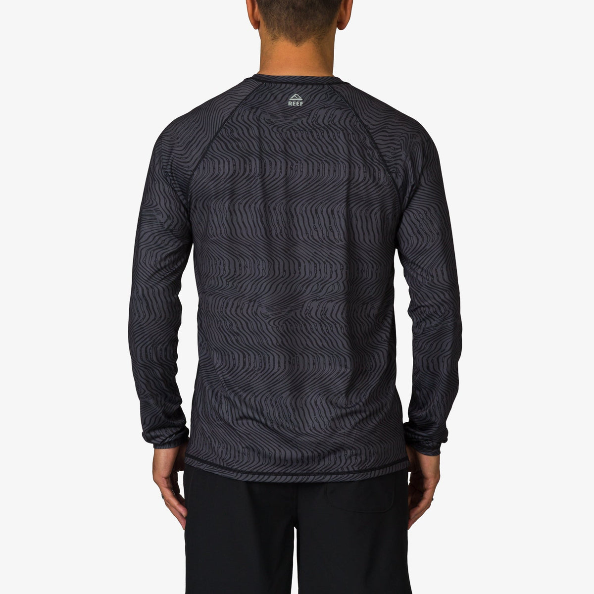 Back view of men's Dune Performance Shirt in dark pattern, lightweight and surf-inspired comfort apparel for active beach lifestyles