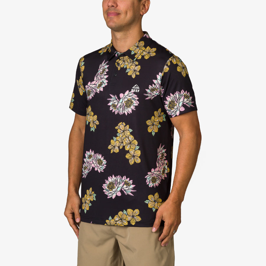 Man wearing a black Wesland Polo with yellow and pink floral print, front and side view, beach-inspired comfort design.