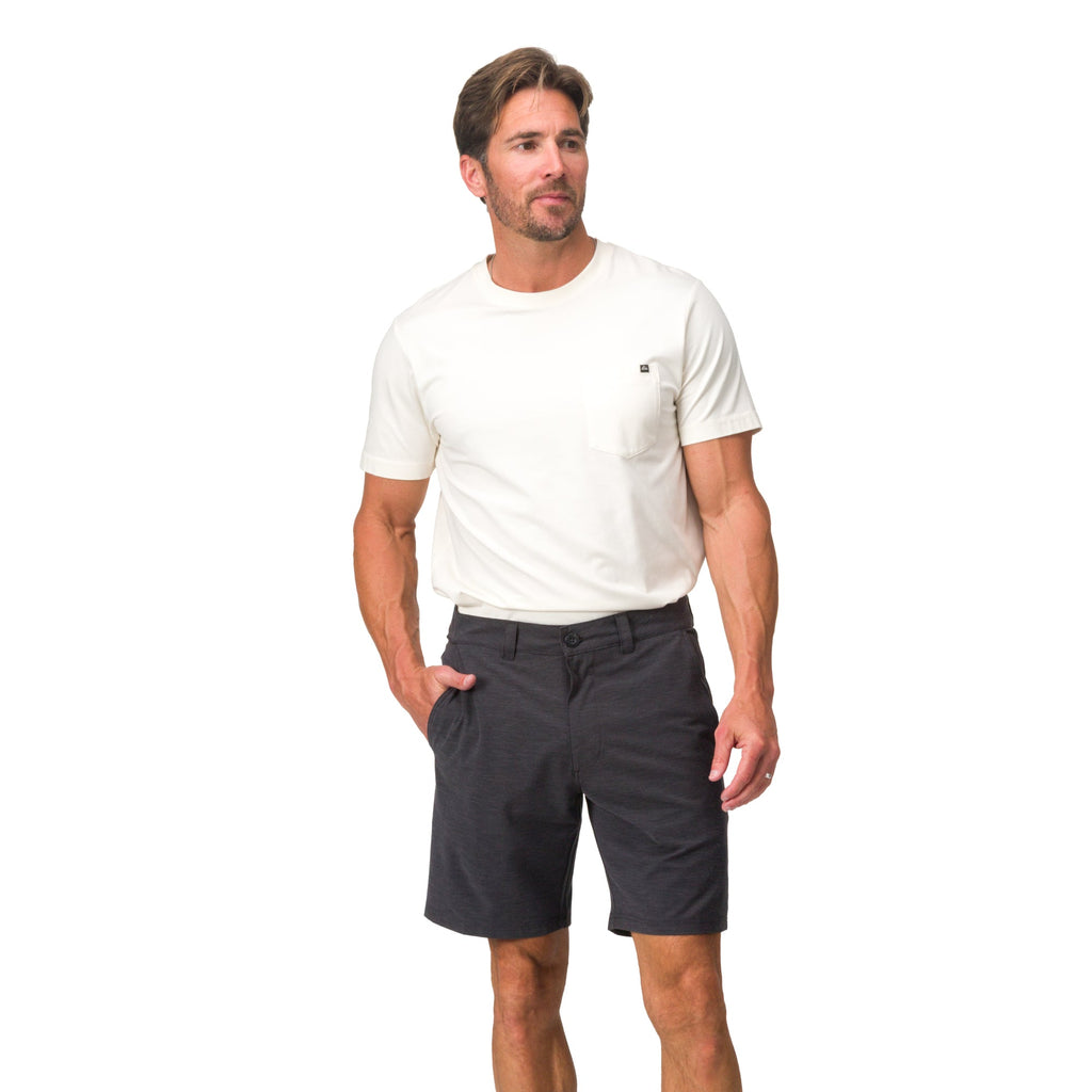 Man wearing black Destro Hybrid Short facing forward, styled for beach comfort and active casual wear.