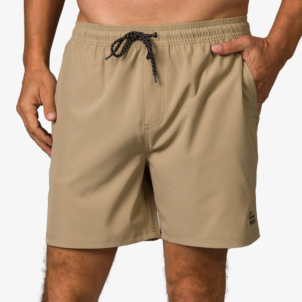 Garland Hybrid Short in tan with black drawstring, front pocket detail, designed for beach comfort and active lifestyles.
