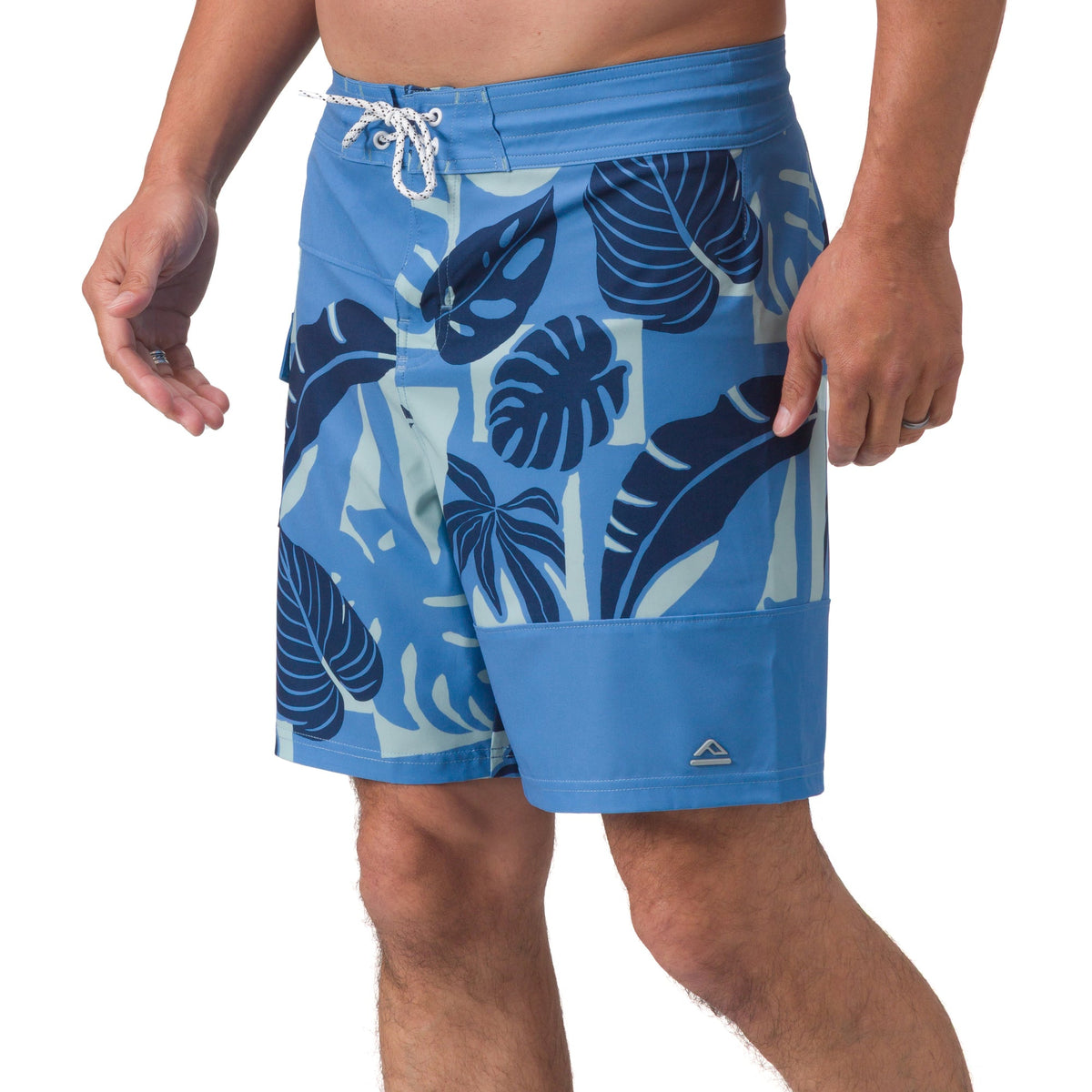 Front view of men's Gonzo Boardshort in blue with tropical leaf print, designed for comfort and beach lifestyles.