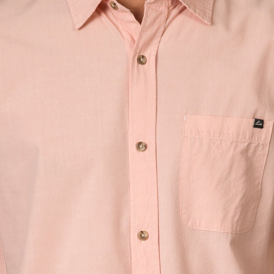 Close-up of a light pink Collins Ss Woven Shirt showing front buttons and chest pocket with surf-inspired design.
