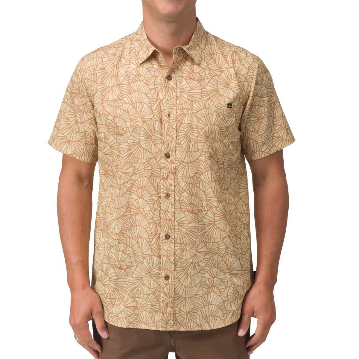 Front view of a man wearing a beige patterned Hartman Woven Shirt, designed for beach-inspired comfort and style.