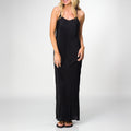 Woman wearing a black Plisse Dress standing straight with relaxed arms, showcasing the dress’s flowy, comfortable fit.