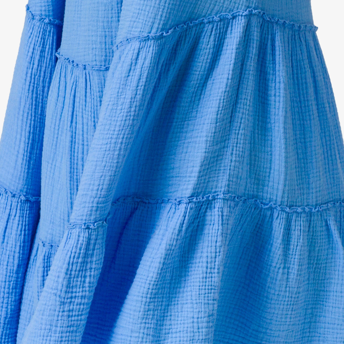Close-up of textured fabric panels in bright blue from the Lainey Maxi Dress, designed for comfort and beach style.