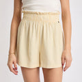 Front view of Ellie Short in light yellow vertical stripes, featuring a gathered waistband for beach-inspired comfort and style.