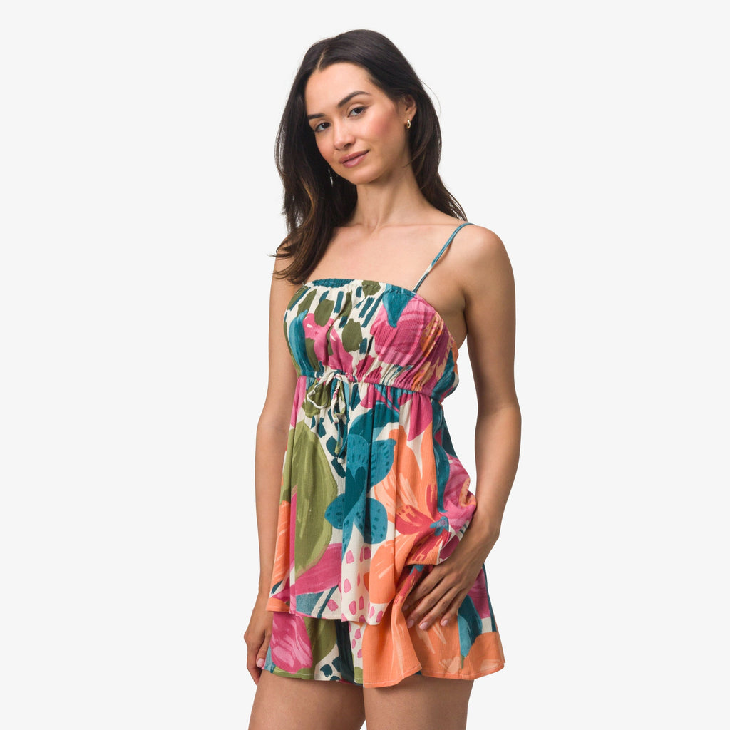 Woman wearing colorful Eve Cami Top with adjustable straps, showing front view, perfect for beach and active lifestyles.