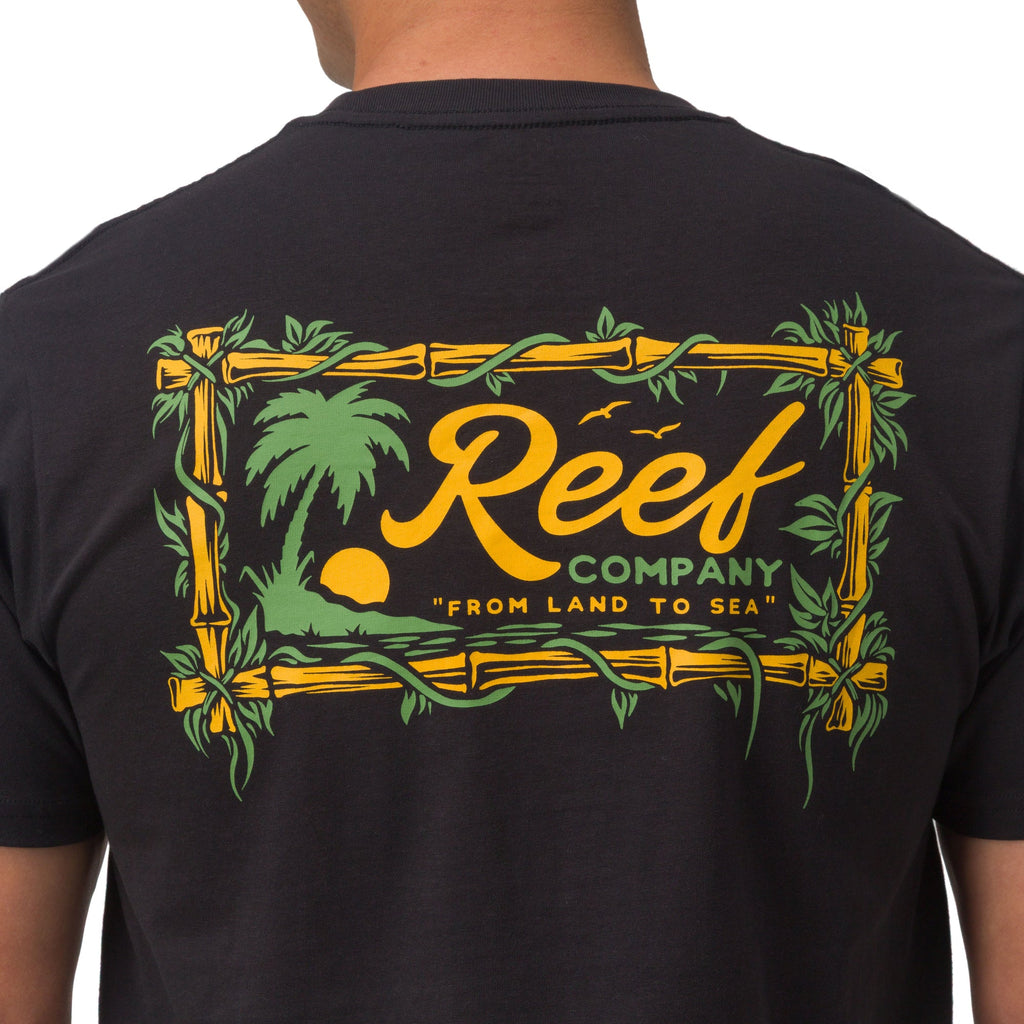Back view of men's Isac Tee showing Reef Company logo with tropical palm and bamboo design on black fabric