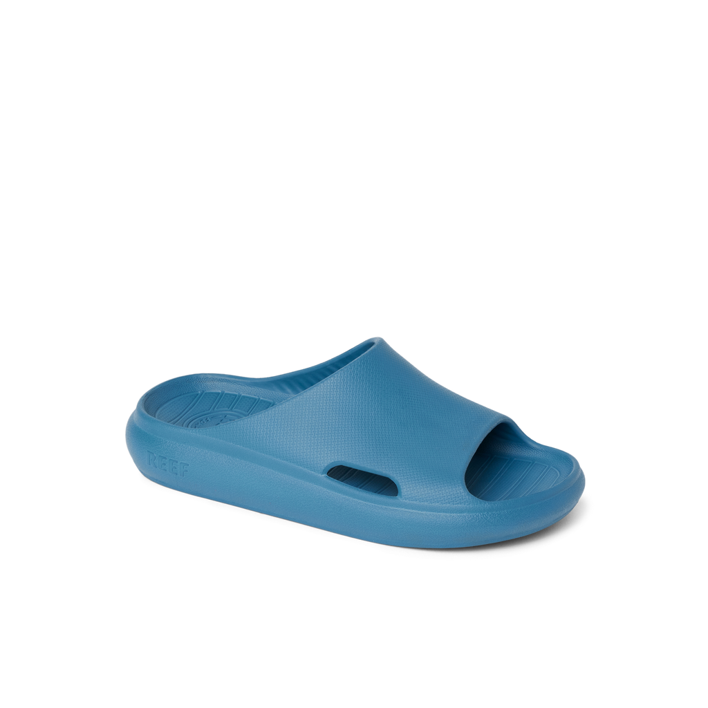 Kids Rio Slide in blue facing right, showing front and side with water-friendly, cushioned design for comfort.