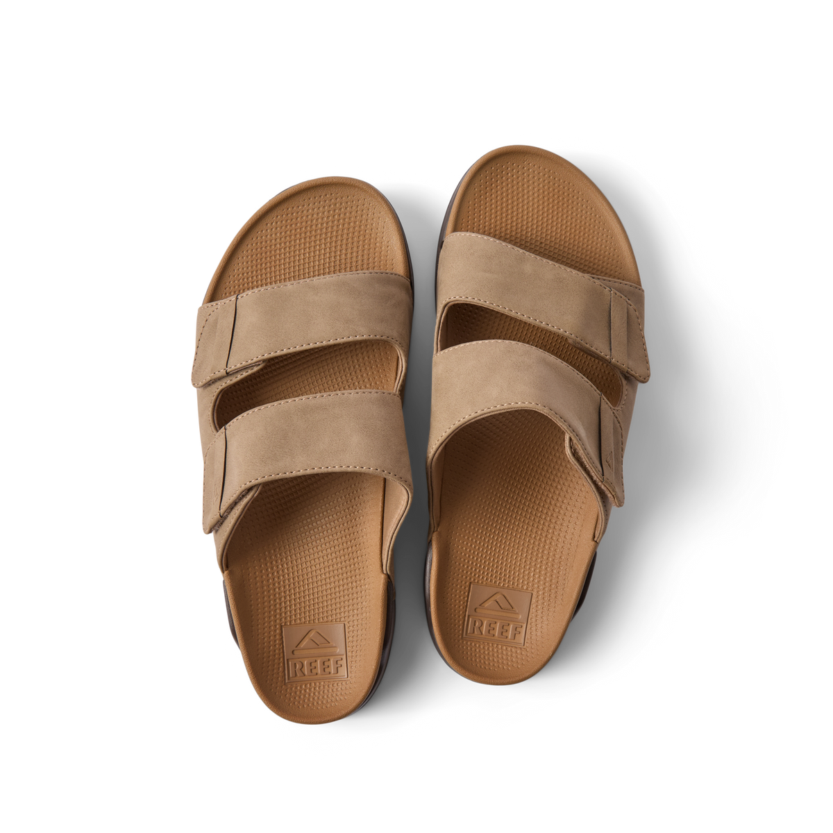 Top view of Phantom Tradewind tan men's sandals with adjustable straps, cushioned footbed, and anatomical arch support for beach comfort.