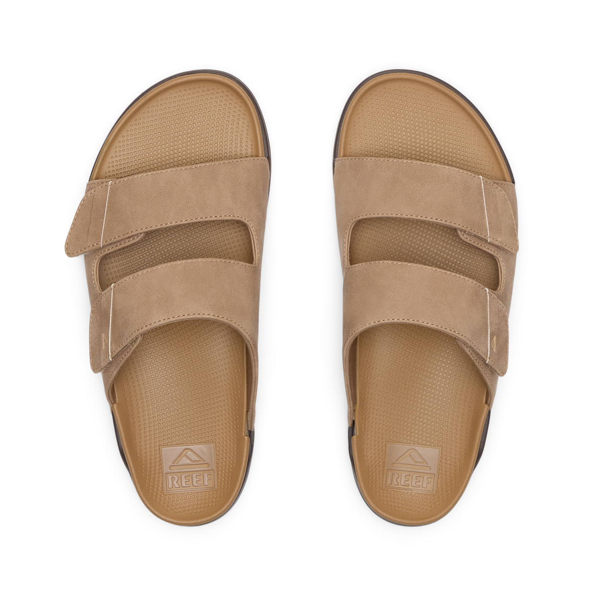 Phantom Tradewind men's tan sandals facing up, showing top straps and textured footbeds with anatomical arch support.