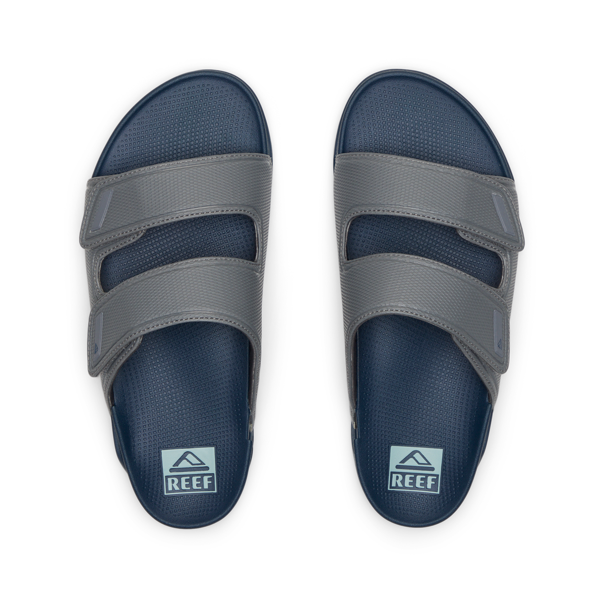 Top view of men's Phantom Tradewind sandals in blue and grey with dual adjustable straps, designed for beach comfort.