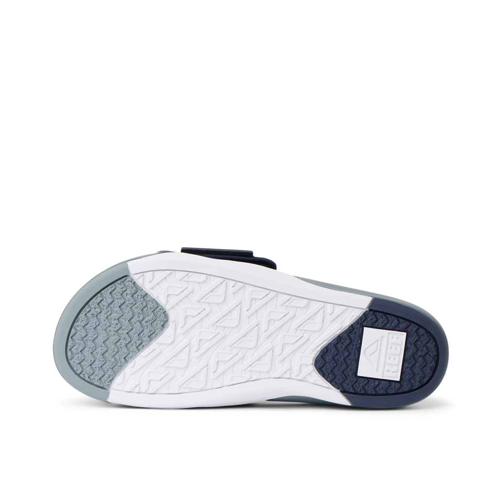 Phantom Slab men's slide showing the sole facing up, highlighting durable, water-friendly outsole for beach comfort.