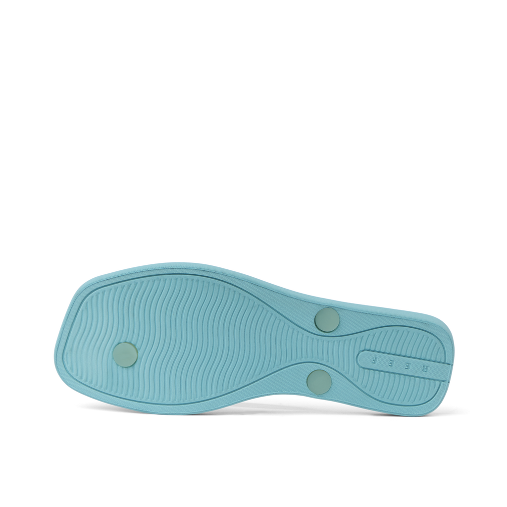 Solaye women's footwear showing the bottom sole in light mint teal designed for beach comfort and durability