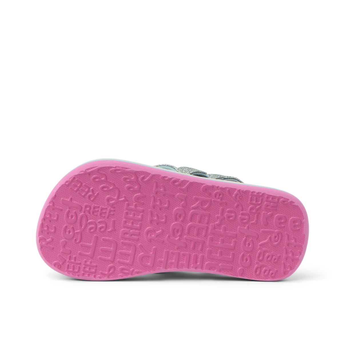 Little Ahi girls’ sandal showing bottom sole facing up with pink textured REEF logo pattern, beach comfort design.