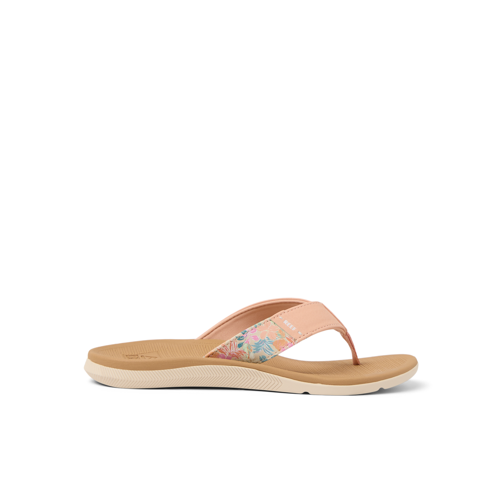 Santa Ana women's peach tan flip flop facing left, showing soft-rebound cushioned footbed and floral strap detail.