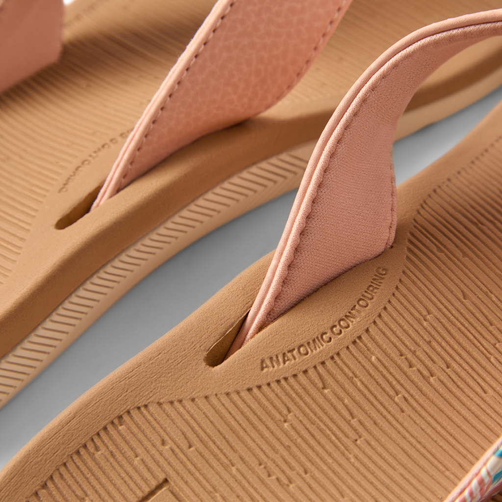 Close-up of the front strap and footbed of Santa Ana women's sandals in peach tan, featuring anatomical arch support.
