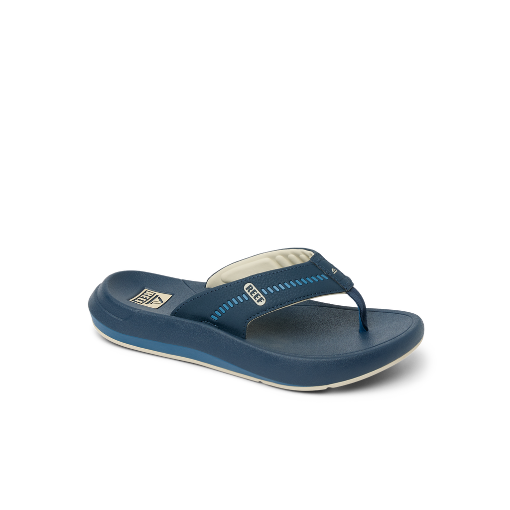Cruiser men's navy blue flip flop facing left, close-up of top and side with soft cushioning and arch support