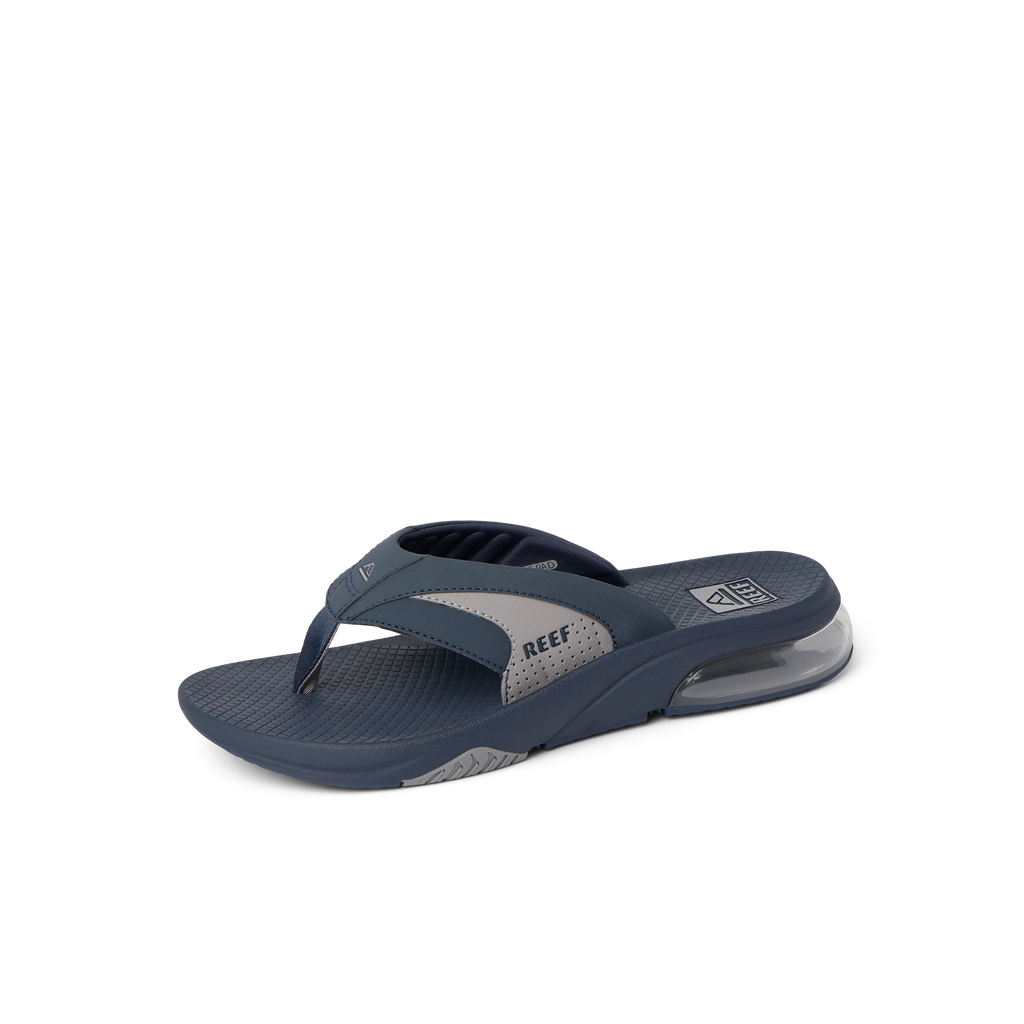 Fanning + men's navy grey flip flop facing left, highlighting arch support and soft-rebound cushioning midsole