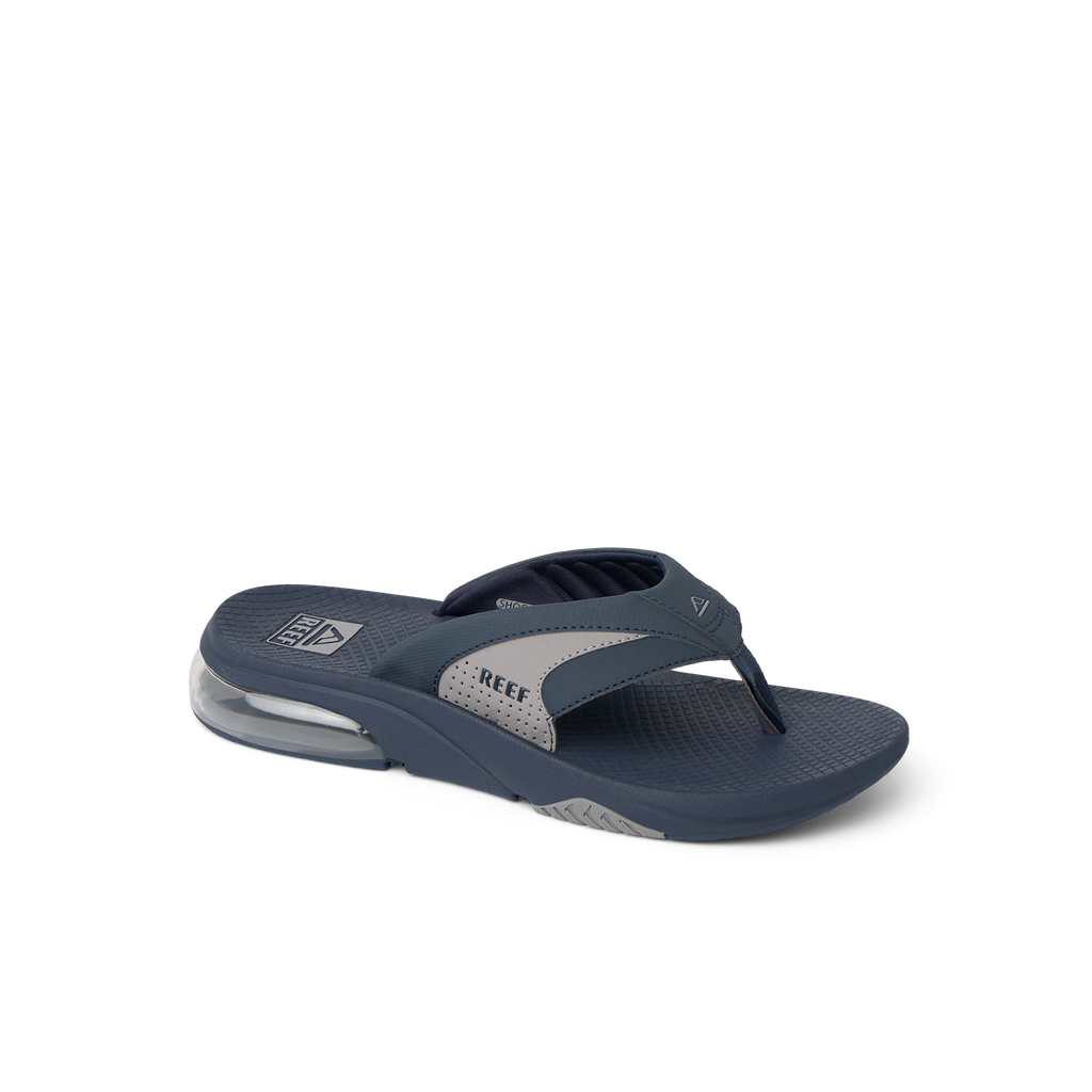 Fanning + men's navy and grey sandal facing right, showing toe post and cushioned arch support for beach comfort