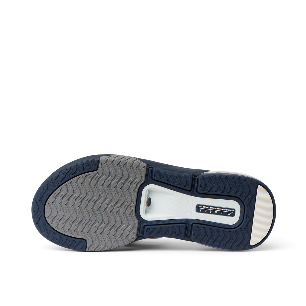Fanning + men's shoe showing sole with durable, water-friendly materials and anatomical arch support, facing upward.