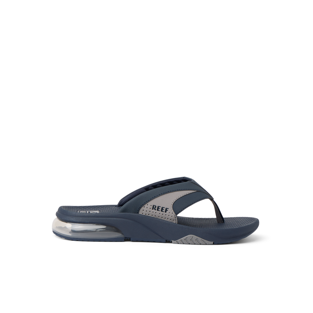 Fanning + men's navy and grey flip flop facing right with soft-rebound cushioning and anatomical arch support