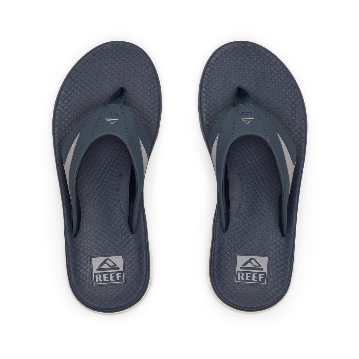 Pair of men's Fanning + flip flops facing upward, navy and grey, with anatomical arch support and cushioned footbeds