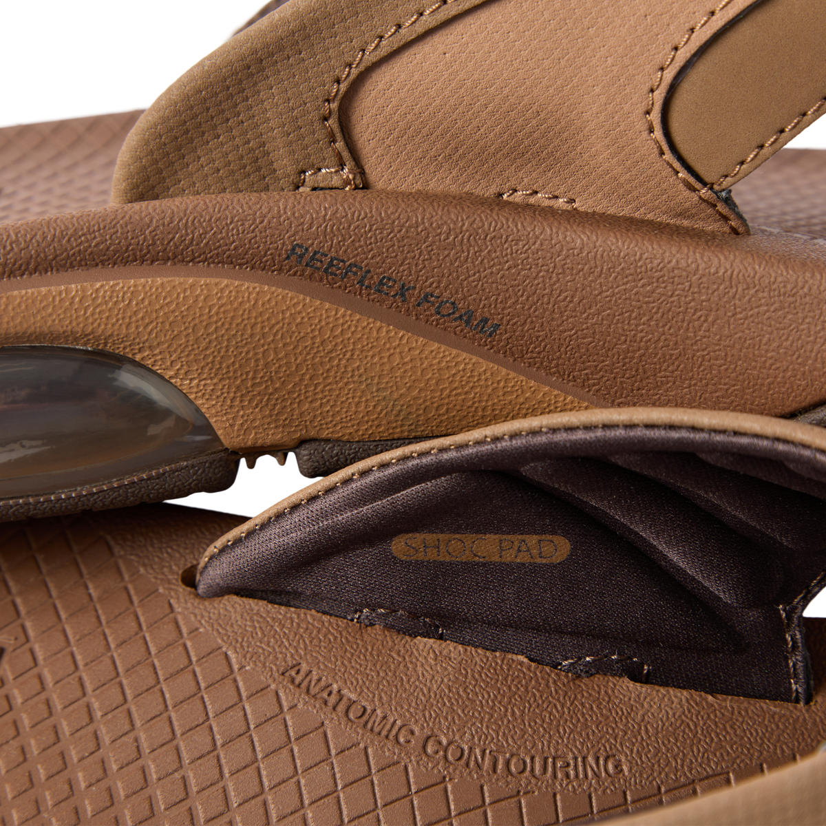 Close-up of the side and inner strap of the Fanning + sandal showing cushioning and shock pad details facing left.