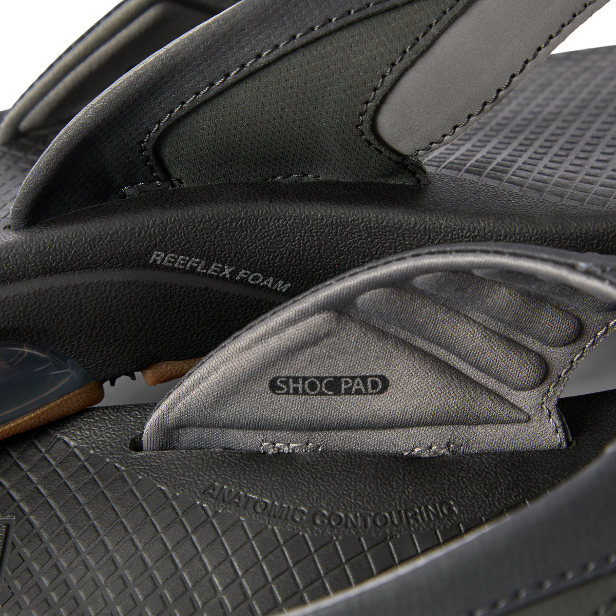 Close-up of the black Fanning + men's sandal footbed and strap showing shock pad and anatomical arch support features.