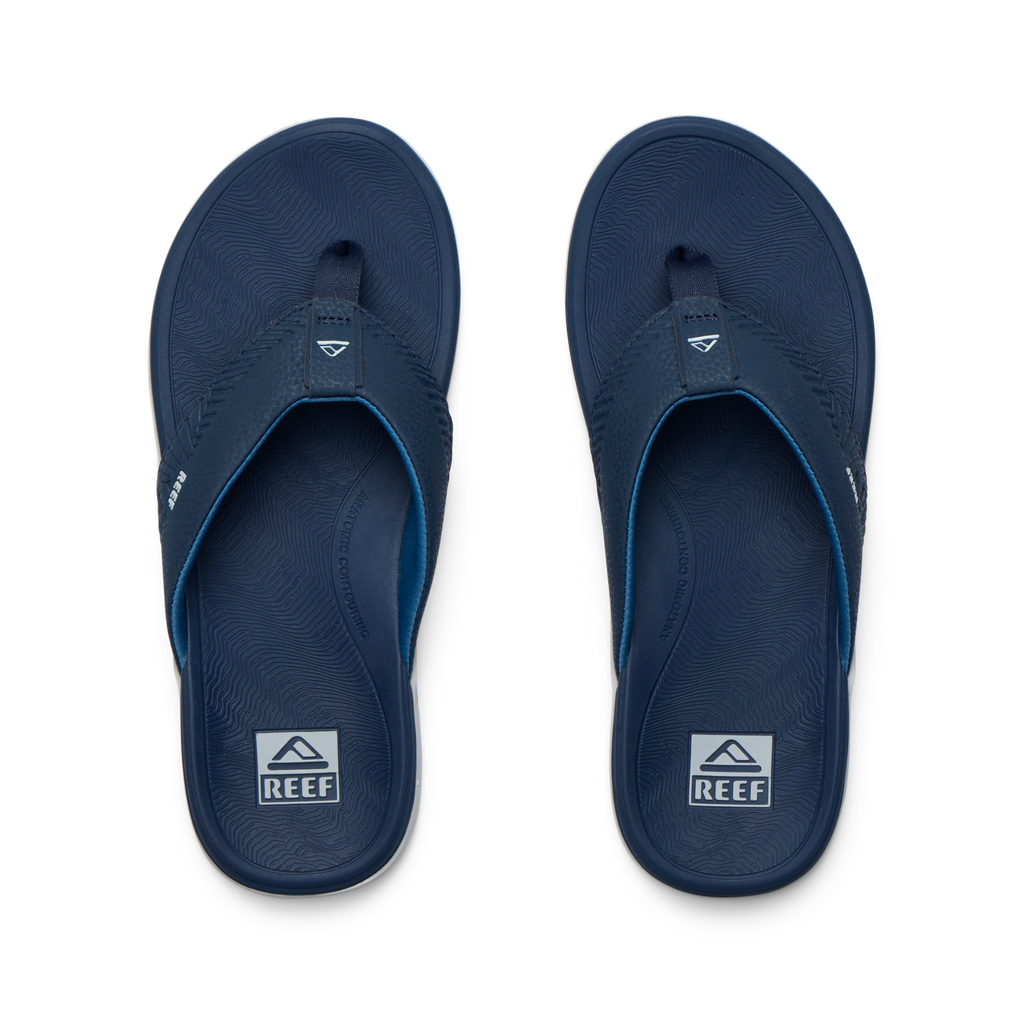 Offshore men's navy blue flip flops top view, surf-inspired comfort with anatomical arch support and cushioned footbed.