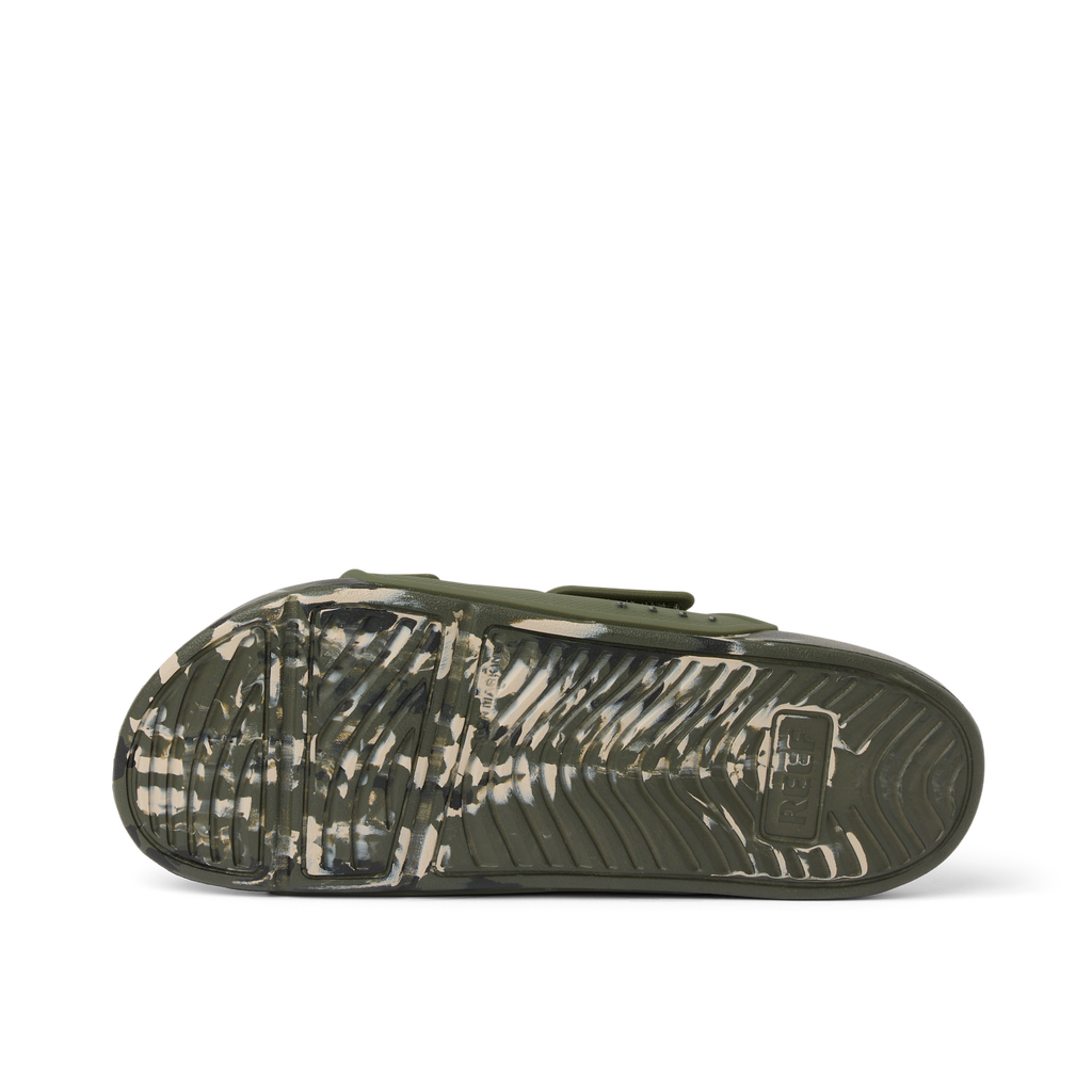 Oasis Adapt men's sandal outsole facing up, camo marble pattern, featuring durable, water-friendly materials and coastal comfort.