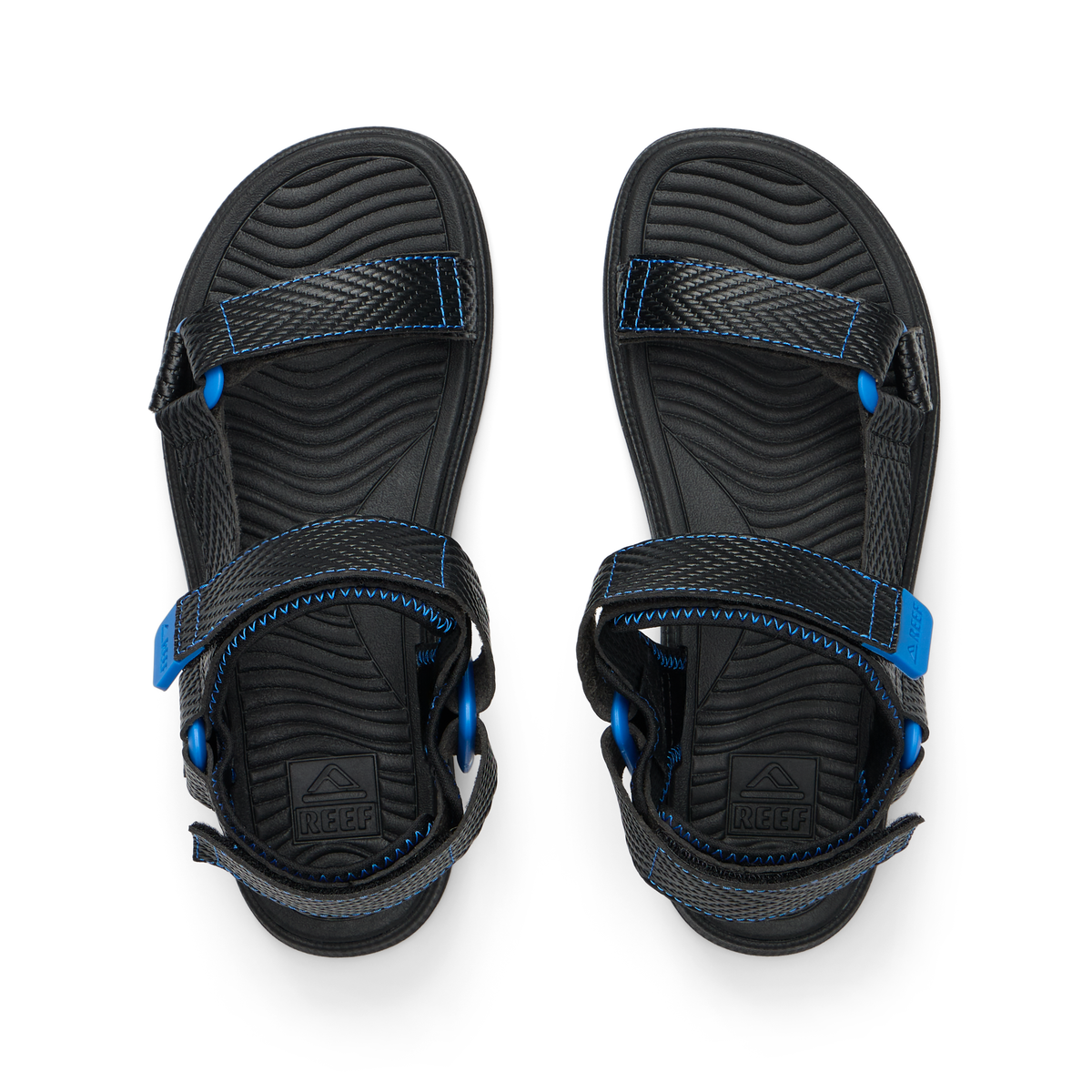 Kids Shoremazing black and blue sandals top view facing upward, showing adjustable straps and cushioned footbeds for comfort.
