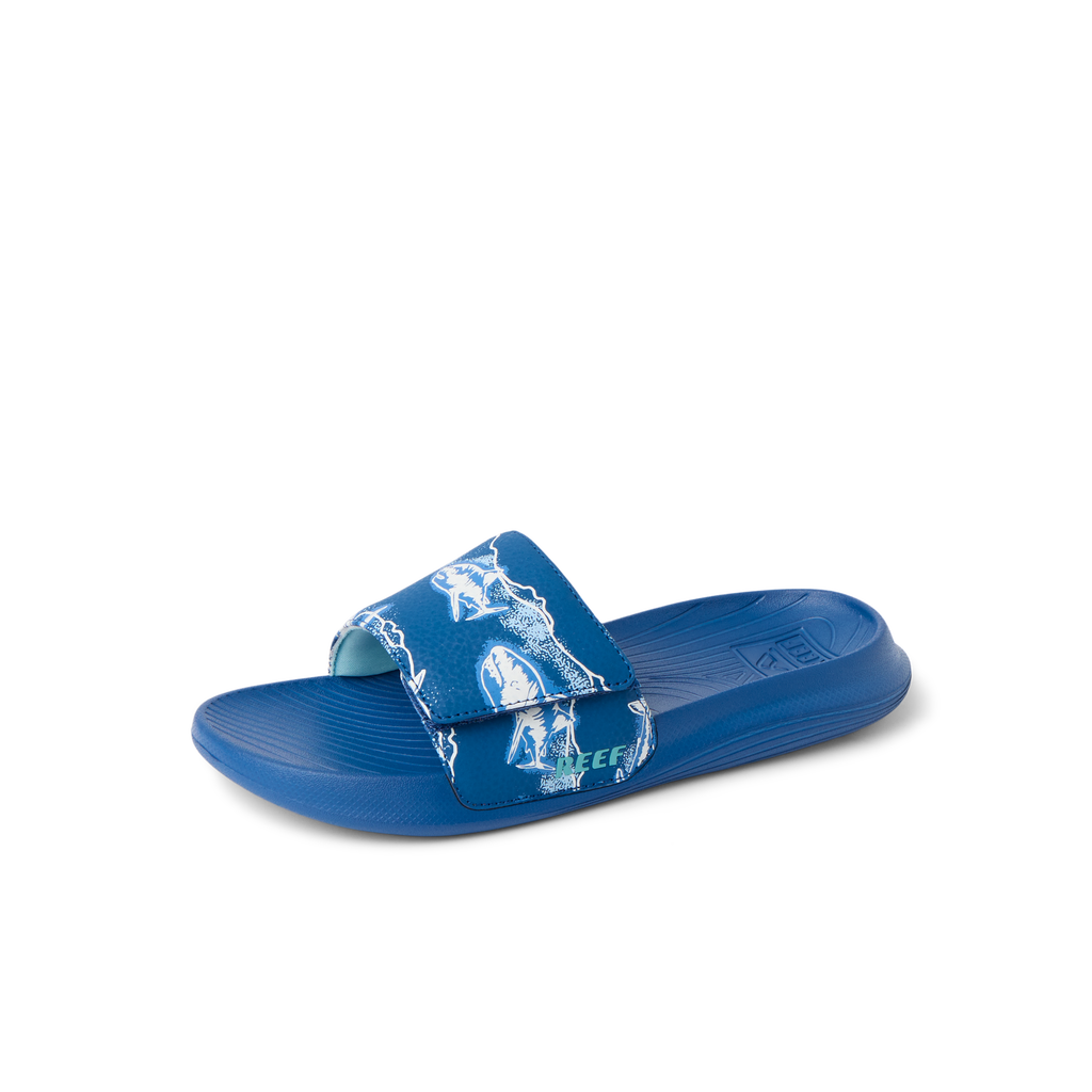 Kids Salty Slide facing left, close-up of royal blue slide with surf-inspired strap and molded footbed for comfort.