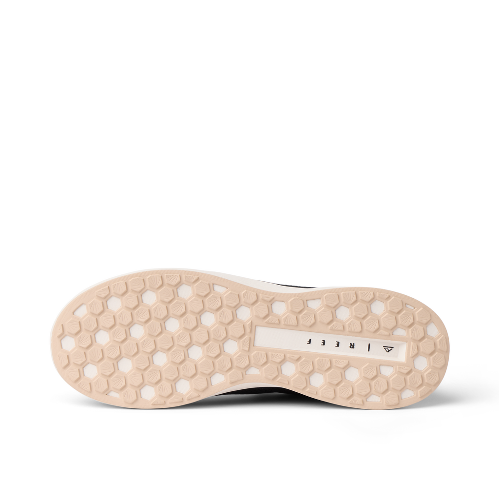 Bottom view of Shoreline Palisades women's shoe facing down, showing durable sole with hex pattern for beach comfort.