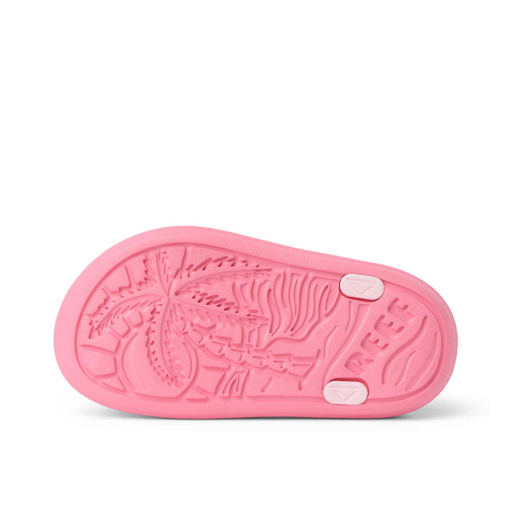 Little Totally Beachin left shoe sole facing up, surf-inspired design with palm tree, durable and water-friendly comfort for girls.