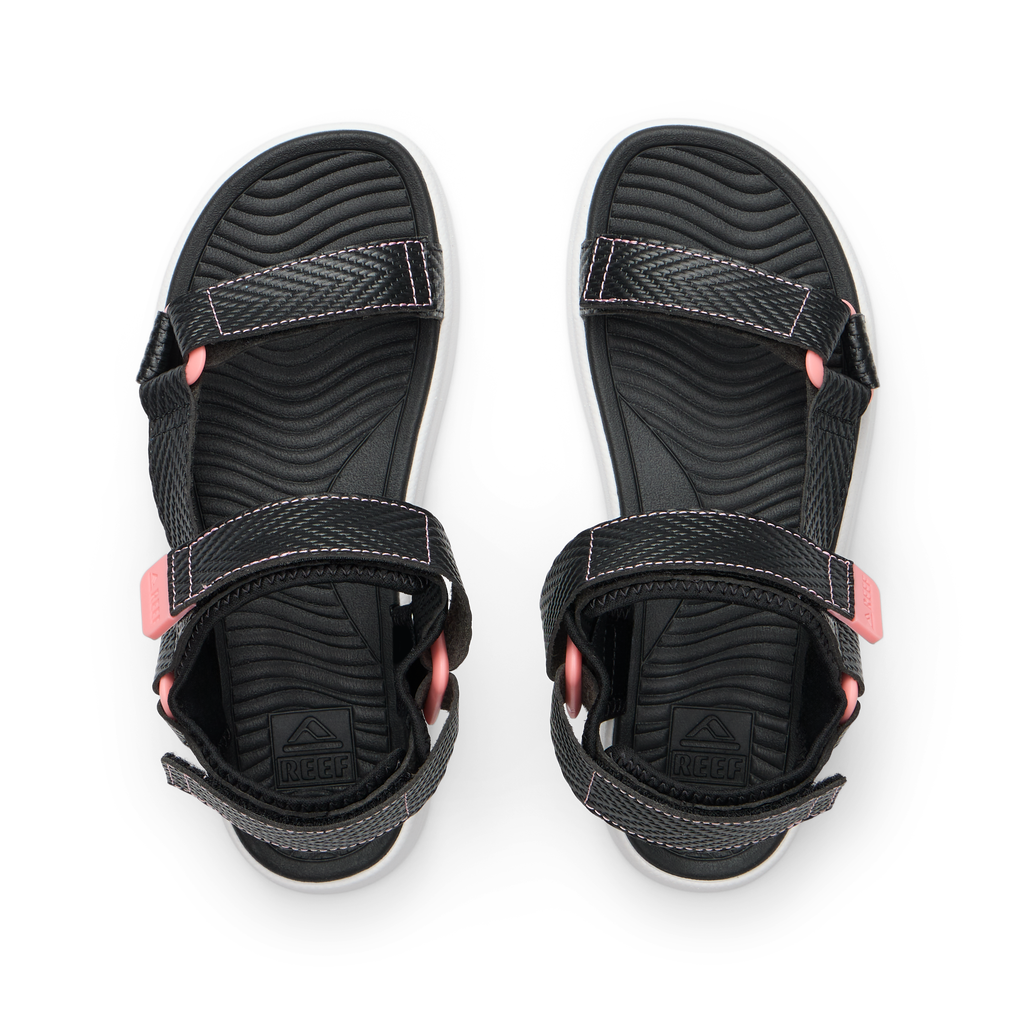 Top view of Kids Shoremazing black and pink sandals with adjustable straps, soft footbed, and anatomical arch support.