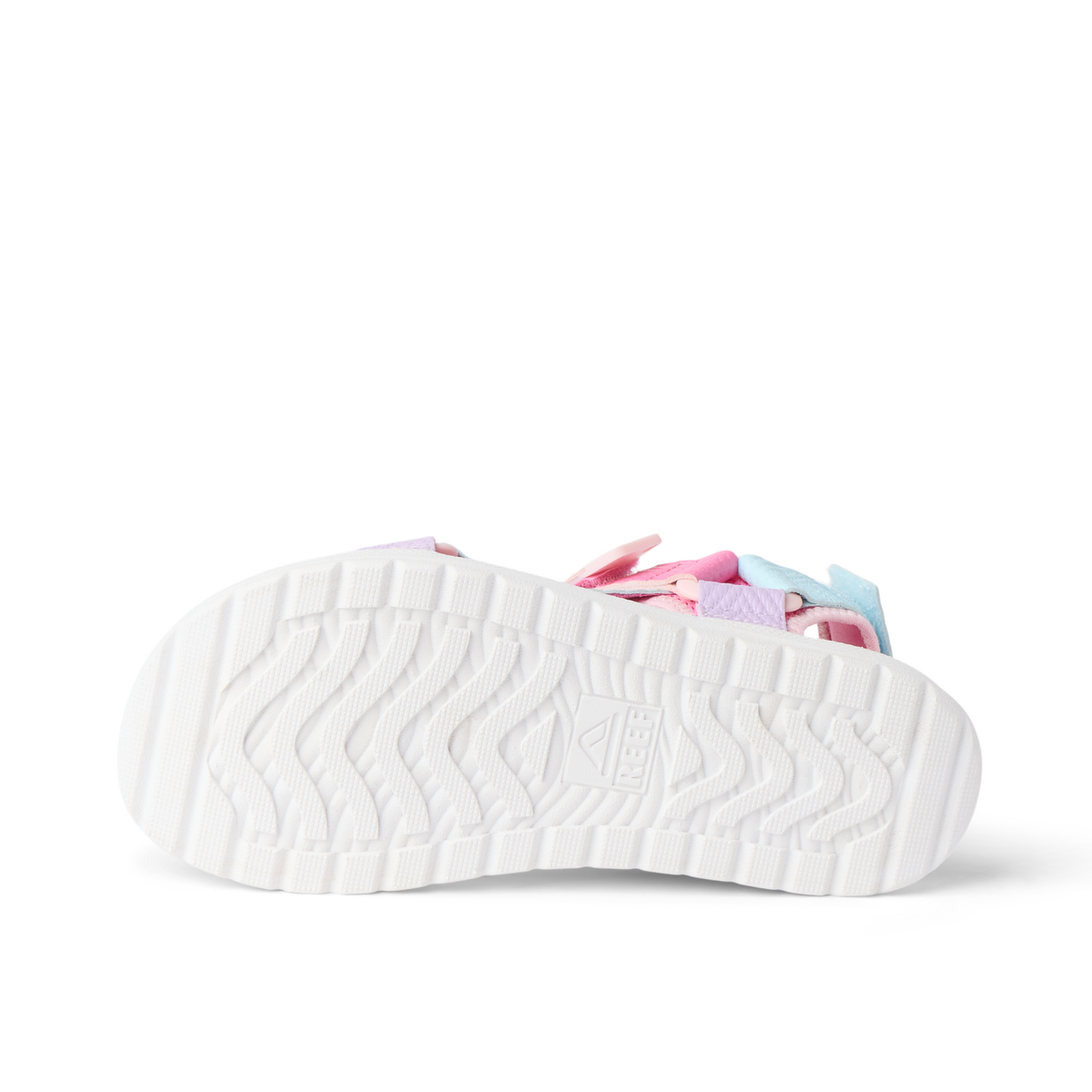 Kids Shoremazing shoe showing white sole facing up with pink and blue upper, beach-inspired comfort and arch support design.