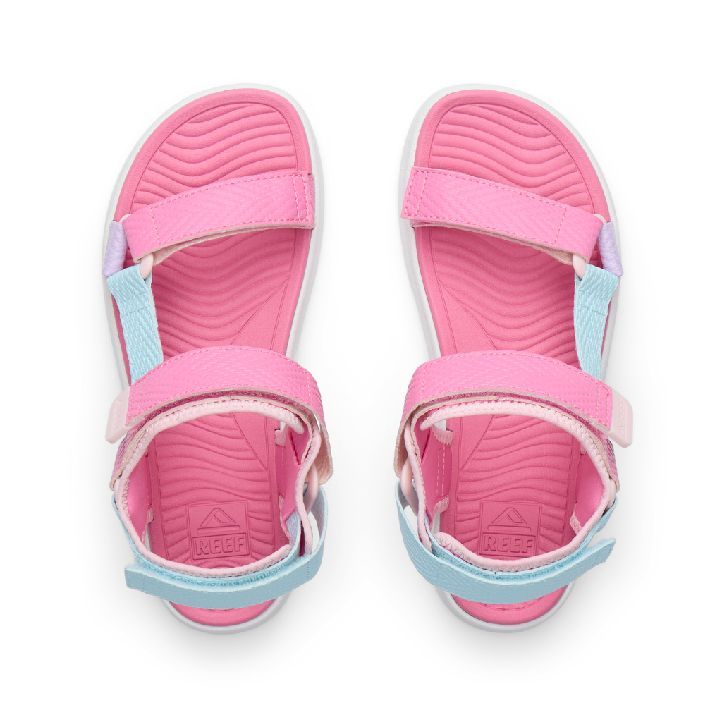 Top view of pink and blue Kids Shoremazing sandals for girls with anatomical arch support and cushioned footbed.