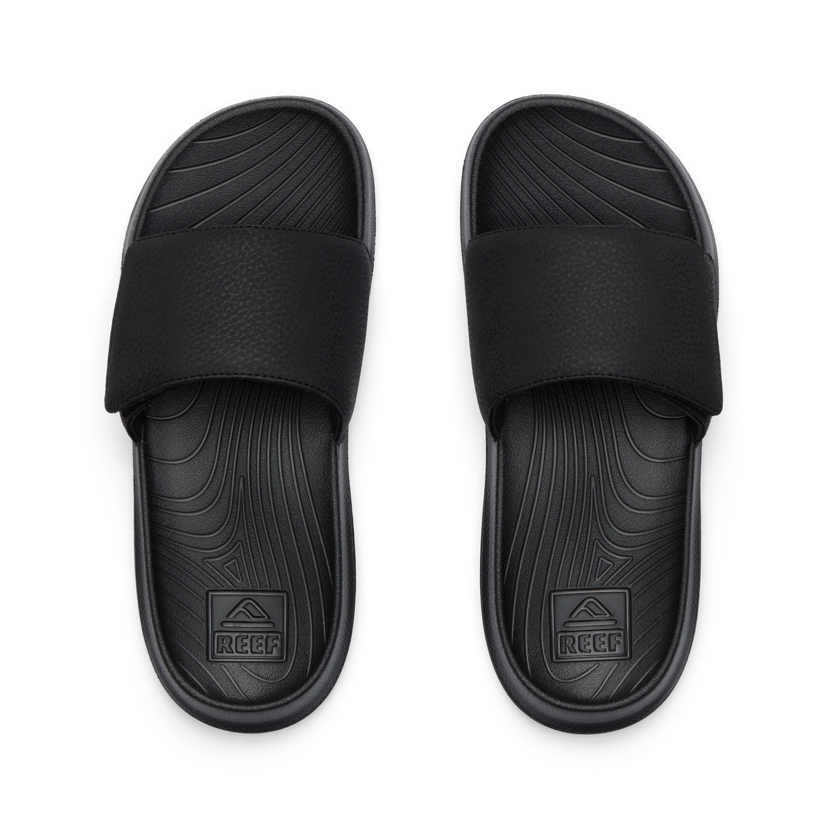 Kids Salty Slide top view showing black water-friendly slides with anatomical arch support and soft cushioning for boys.