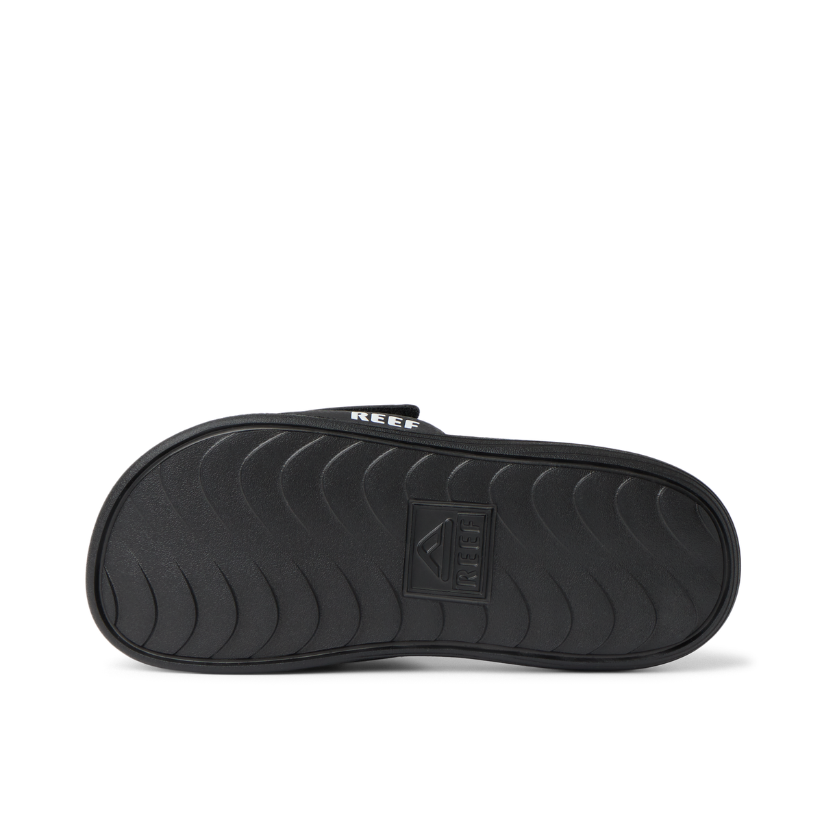 Little Salty Slide showing black outsole facing up, close-up of water-friendly durable sole with arch support for boys age 2-4.