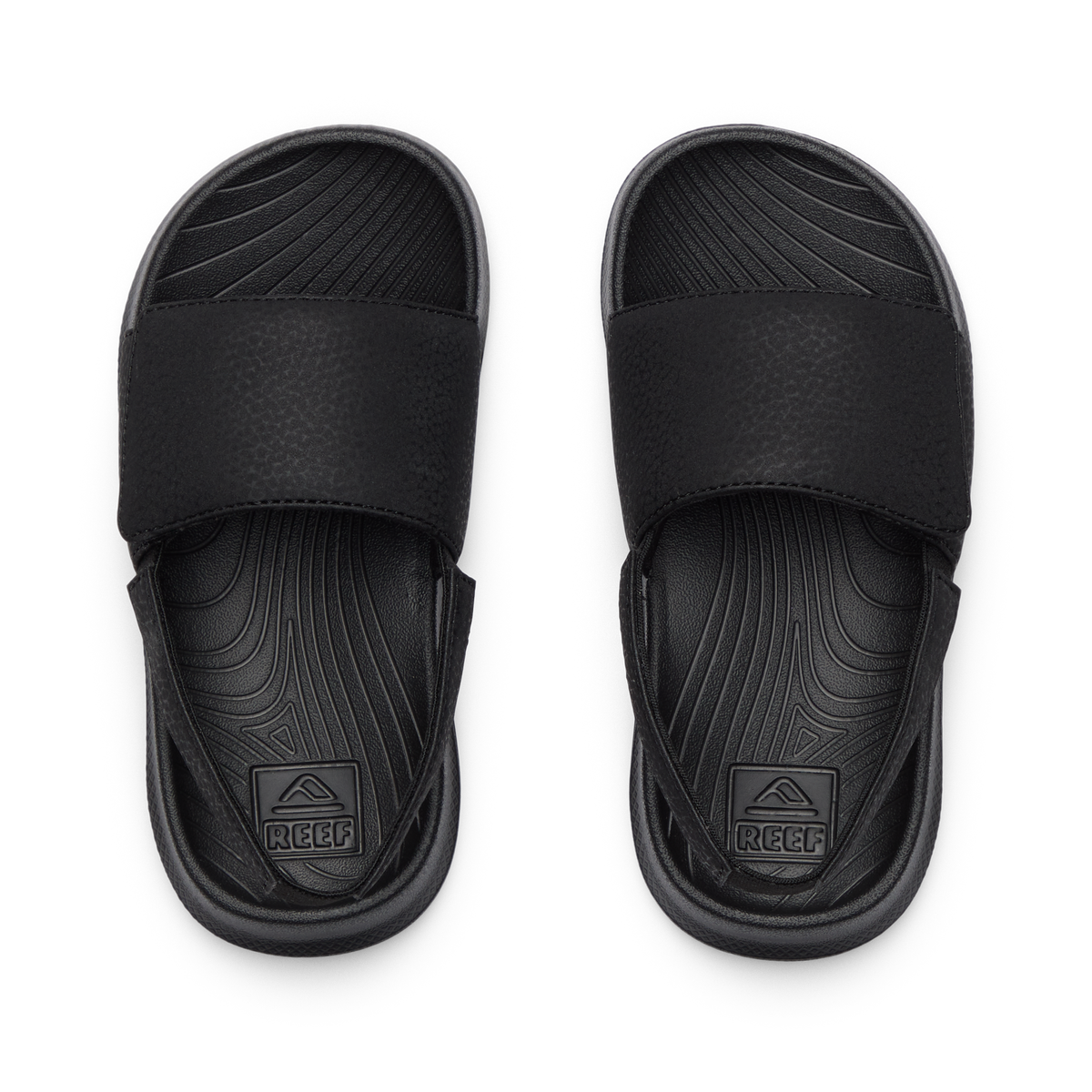 Top view of Little Salty Slide sandals for boys, featuring molded footbeds and soft cushioning for beach comfort.