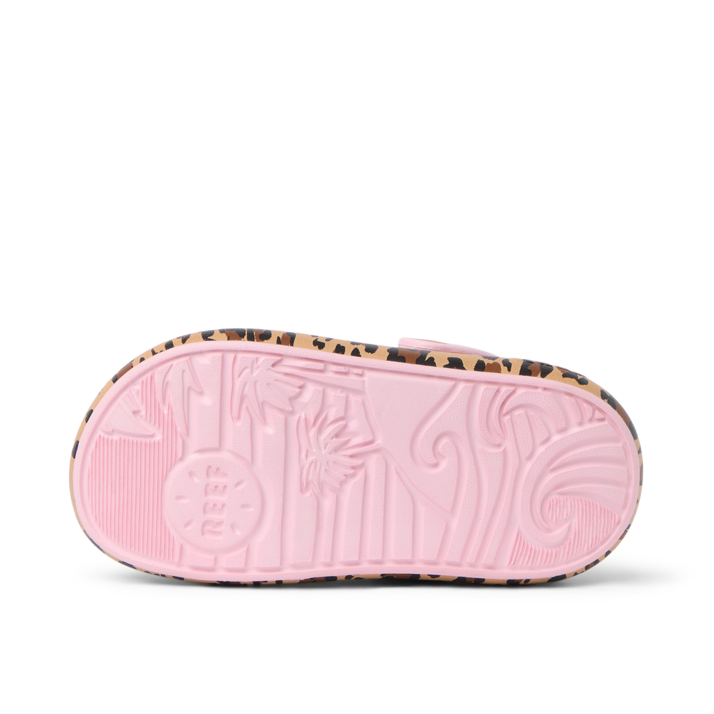 Little Rio Slide showing bottom sole with pink textured arch support and beach-inspired patterns facing up, close-up view.