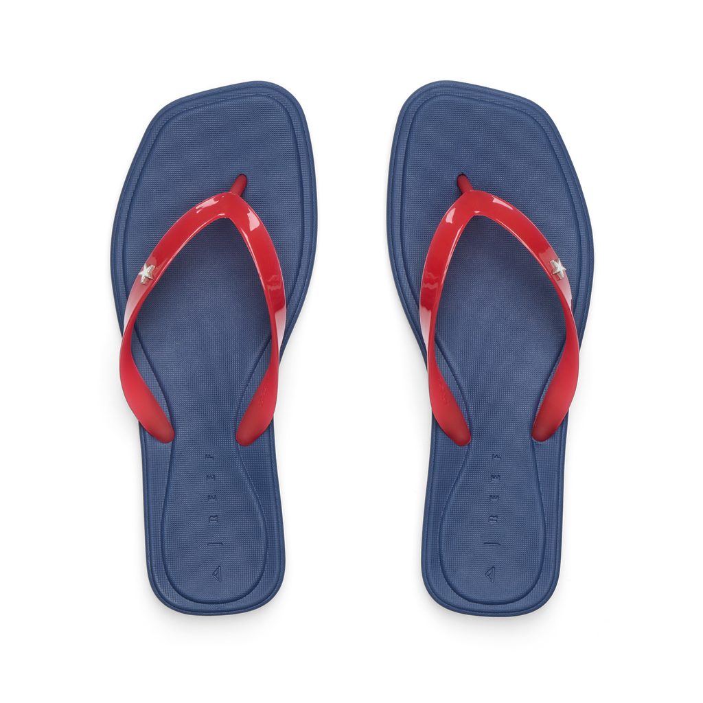 Solaye women's REEF flip flops top view, blue cushioned footbed with red straps, surf-inspired comfort sandals facing up.