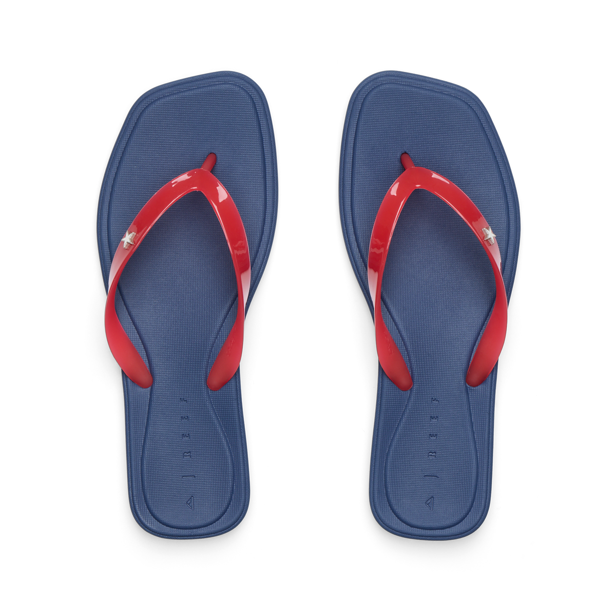 Solaye women's REEF flip flops top view, blue cushioned footbed with red straps, surf-inspired comfort sandals facing up.