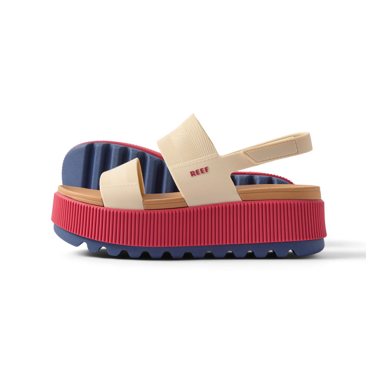 Water Vista Higher women's sandal facing left with pink platform sole, beige straps, and blue cushioned footbed.