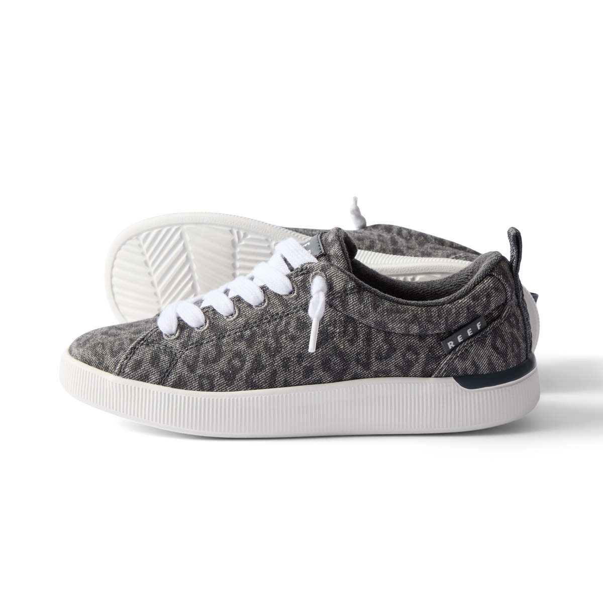 Neptune Alana women's sneaker facing right, leopard print fabric with white laces, featuring cushioned sole and arch support.