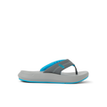 Cruiser flip flop facing right with charcoal gray straps, aqua accents, and cushioned sole for beach comfort by REEF.